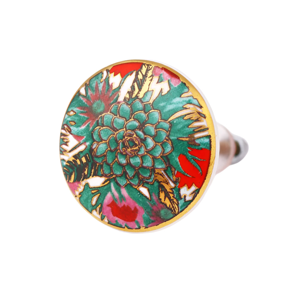 fargeglad keramikk knott dekorert med vakre tropiske planter i grønne og røde farger