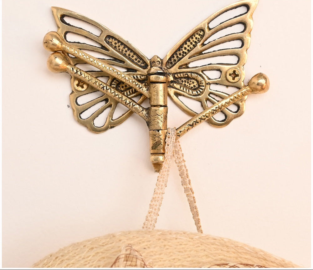 dekorativ knagg med bevegelige armer - designet som en sommerfugl